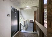 Thumbnail 38 of 42 - This is a photo of the hallway at Cambridge Court Apartments in Dallas, TX.
