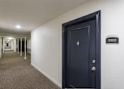 Thumbnail 39 of 42 - This is a photo of the hallway at Cambridge Court Apartments in Dallas, TX.