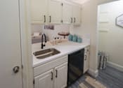 Thumbnail 8 of 42 - Photo of the kitchen in a 692 square foot 1 bed, 1 bath model aprtment at Cambridge Court Apartments in Dallas Texas