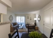 Thumbnail 19 of 40 - This is a photo of the living room from the dining area of the 515 square foot 1 bedroom apartment at Canyon Creek Apartments in Dallas, TX
