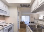 Thumbnail 14 of 40 - This is a photo of the kitchen of the 515 square foot 1 bedroom apartment at Canyon Creek Apartments in Dallas, TX