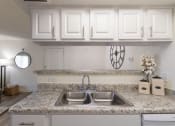 Thumbnail 15 of 40 - This is a photo of the kitchen of the 515 square foot 1 bedroom apartment at Canyon Creek Apartments in Dallas, TX