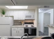 Thumbnail 4 of 40 - This is a photo of the kitchen of the 575 square foot 1 bedroom, 1 bath apartment at Canyon Creek Apartments in Dallas, TX
