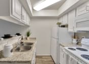 Thumbnail 2 of 40 - This is a photo of the kitchen in the 477 square foot 1 bedroom apartment at Canyon Creek Apartments in Dallas, TX.