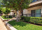 Thumbnail 38 of 40 - Apartment building exterior at Canyon Creek Apartments in the Dallas Midtown neighborhood of Dallas, TX.