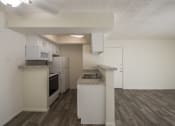 Thumbnail 5 of 40 - This is a photo of the living room and kitchen of the 550 square foot 1 bedroom apartment at Canyon Creek Apartments in Dallas, TX