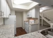 Thumbnail 10 of 40 - This is a photo of the kitchen in a 717 square foot 1 bedroom, 1 bath apartment at Canyon Creek Apartments in Dallas, TX