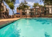 Thumbnail 35 of 40 - This is a photo of the pool area at Canyon Creek Apartments in Dallas, TX.