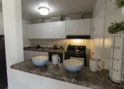 Thumbnail 3 of 35 - This is a photo of the kitchen in the 740 square foot 1 bedroom model apartment at Compton Lake Apartments in Mt. Healthy, OH.