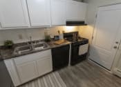 Thumbnail 2 of 35 - This is a photo of the kitchen in the 740 square foot 1 bedroom model apartment at Compton Lake Apartments in Mt. Healthy, OH.