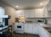 Thumbnail 26 of 35 - This is a photo of the kitchen in the resident clubhouse at Compton Lake Apartments in Mt. Healthy, OH.