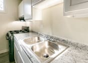 Thumbnail 29 of 62 - This is a photo of the kitchen in the 550 square foot 1 bedroom, 1 bath patio apartment at College Woods Apartments in the North College Hill neighborhood of Cincinnati, OH.