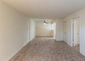 Thumbnail 31 of 62 - This is a photo of the living room and dining area in the 550 square foot 1 bedroom, 1 bath patio apartment at College Woods Apartments in the North College Hill neighborhood of Cincinnati, OH.