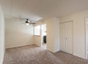 Thumbnail 34 of 62 - This is a photo of the living room and dining area in the 550 square foot 1 bedroom, 1 bath patio apartment at College Woods Apartments in the North College Hill neighborhood of Cincinnati, OH.