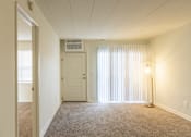 Thumbnail 36 of 62 - This is a photo of the living room in the 550 square foot 1 bedroom, 1 bath patio apartment at College Woods Apartments in the North College Hill neighborhood of Cincinnati, OH.