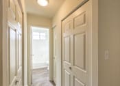 Thumbnail 39 of 62 - This is a photo of the hallway leading to the bathroom in the 550 square foot 1 bedroom, 1 bath patio apartment at College Woods Apartments in the North College Hill neighborhood of Cincinnati, OH.