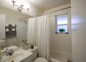 Thumbnail 20 of 62 - This is a photo of the bathroom of the 550 square foot 1 bedroom, 1 bath, balcony floor plan model apartment at College Woods Apartments in Cincinnati, OH.