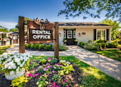 Thumbnail 72 of 78 - A rental office sign is in front of the leasing office Landscaped grounds next to the pool at Deer Hill Apartments in the Mount Washington neighborhood of Cincinnati, OH.