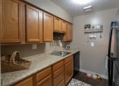 Thumbnail 7 of 77 - This is a photo of the kitchen in the upgraded 650 square foot, 1 bedroom, 1 bath model apartment at Deer Hill Apartments in Cincinnati, Ohio.
