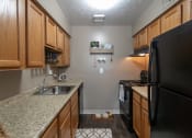 Thumbnail 6 of 77 - This is a photo of the kitchen in the upgraded 650 square foot, 1 bedroom, 1 bath model apartment at Deer Hill Apartments in Cincinnati, Ohio.