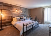 Thumbnail 37 of 77 - This is a photo of the bedroom with barb wood wall in the upgraded 650 square foot, 1 bedroom, 1 bath model apartment at Deer Hill Apartments in Cincinnati, Ohio.