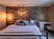 Thumbnail 38 of 77 - This is a photo of the bedroom with barb wood wall in the upgraded 650 square foot, 1 bedroom, 1 bath model apartment at Deer Hill Apartments in Cincinnati, Ohio.