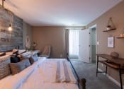 Thumbnail 39 of 77 - This is a photo of the bedroom with barb wood wall in the upgraded 650 square foot, 1 bedroom, 1 bath model apartment at Deer Hill Apartments in Cincinnati, Ohio.