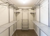 Thumbnail 40 of 77 - This is a photo of the bedroom walk-in closet with customizable closet system in the upgraded 650 square foot, 1 bedroom model apartment at Deer Hill Apartments in Cincinnati, Ohio.