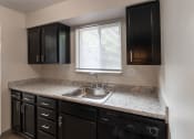 Thumbnail 2 of 77 - This is a photo of the kitchen in an upgraded 950 square foot, 2 bedroom apartment at Deer Hill Apartments in Cincinnati, OH.