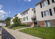 Thumbnail 77 of 77 - This is a picture looking down a row of apartment entrances at Deer Hill Apartments in Cincinnati, Ohio.