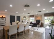 Thumbnail 73 of 77 - a dining room and living room with a table and chairs