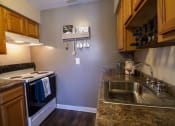 Thumbnail 12 of 77 - This is a photo of the kitchen in the 950 square foor, 2 bedroom apartment at Deer Hill Apartments in Cincinnati, OH.