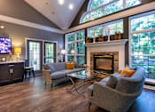 Thumbnail 74 of 82 - A living room with a grey couch and a fireplace  at Fairfield Pointe Apartments in Fairfield, Ohio.