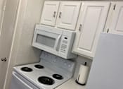 Thumbnail 13 of 31 - This is a photo of Leasing Office kitchen/2 bedroom, 2 bath 1116 quare foot "C"  floor plan at Woodbridge Apartments in Dallas, Texas.