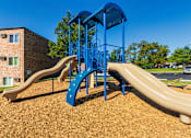 Thumbnail 38 of 46 - Community playground with slides and safety surface at Lisa Ridge Apartments on the west side of Cincinnati