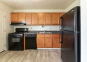 Thumbnail 5 of 56 - This is a photo of the kitchen in the 1004 square foot, 2 bedroom, 1.5 bath townhome floor plan at Lake of the Woods Apartments in Cincinnati, OH.