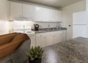 Thumbnail 3 of 56 - This is a photo of the kitchen of the 1 bedroom, 631 square foot model apartment at Lake of the Woods Apartments in Cincinnati, OH.