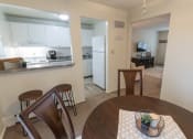 Thumbnail 20 of 56 - This is a photo of the kitchen and living room from the dining room of the 1 bedroom, 631 square foot model apartment at Lake of the Woods Apartments in Cincinnati, OH.