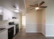 Thumbnail 12 of 73 - This is a photo of the kitchen and dining area with built-in bookshelf of the 560 square foot 1 bedroom, 1 bath Elm floor plan at Montana Valley Apartments in Cincinnati, OH.