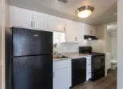 Thumbnail 5 of 70 - This is a photo of the kitchen in an upgraded 500 square foot 1 bedroom, 1 bath Cedar floor plan at Montana Valley Apartments in Cincinnati, OH.