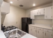 Thumbnail 10 of 70 - This is a photo the kitchen with white cabinets in the 925 square foot, Hazelnut 2 bedroom, 1 bath apartment at Montana Valley Apartments in the Westwood neighborhood of Cincinnati, OH.