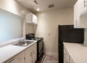Thumbnail 26 of 70 - This is a photo the kitchen with white cabinets in the 925 square foot, Hazelnut 2 bedroom, 1 bath apartment at Montana Valley Apartments in the Westwood neighborhood of Cincinnati, OH.