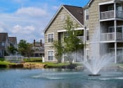 Thumbnail 22 of 147 - This is a picture of a pond with a fountain and  building exteriors at Nantucket Apartments, in Loveland, OH.