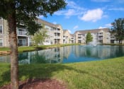 Thumbnail 143 of 147 - This is a picture of a fountain in a pond with building exteriors at Nantucket Apartments, in Loveland, OH.