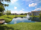 Thumbnail 136 of 147 - This is a picture of a pond with a fountain and  building exteriors at Nantucket Apartments, in Loveland, OH.