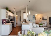 Thumbnail 73 of 147 - This is a photo of the kitchen and living room from the dining area in the 1016 square foot, 2 bedroom, 2 bath Nautica floor plan at Nantucket Apartments in Loveland, OH.