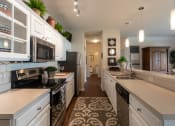 Thumbnail 1 of 147 - This is a photo of the kitchen in the 2 bedroom, 2 bath Islander floor plan at Nantucket Apartments in Loveland, OH.