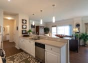 Thumbnail 25 of 147 - This is a photo of the living room from the kitchen in the 2 bedroom, 2 bath Islander floor plan at Nantucket Apartments in Loveland, OH.