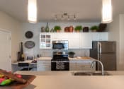 Thumbnail 26 of 147 - This is a photo of the kitchen in the 2 bedroom, 2 bath Islander floor plan at Nantucket Apartments in Loveland, OH.