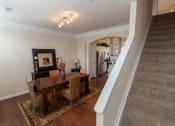Thumbnail 48 of 147 - This is a photo of the dining room and stairwell in the 1242 square foot, 2 bedroom, 2 and 1/2 bath Spinnaker floor plan at Nantucket Apartments in Loveland, OH.